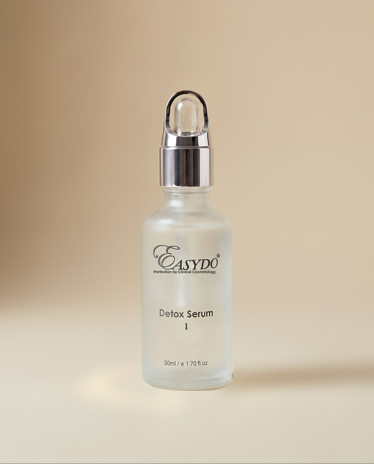 A frosted glass bottle of Easydo Detox Serum with a silver dropper cap, centered on a warm beige background.