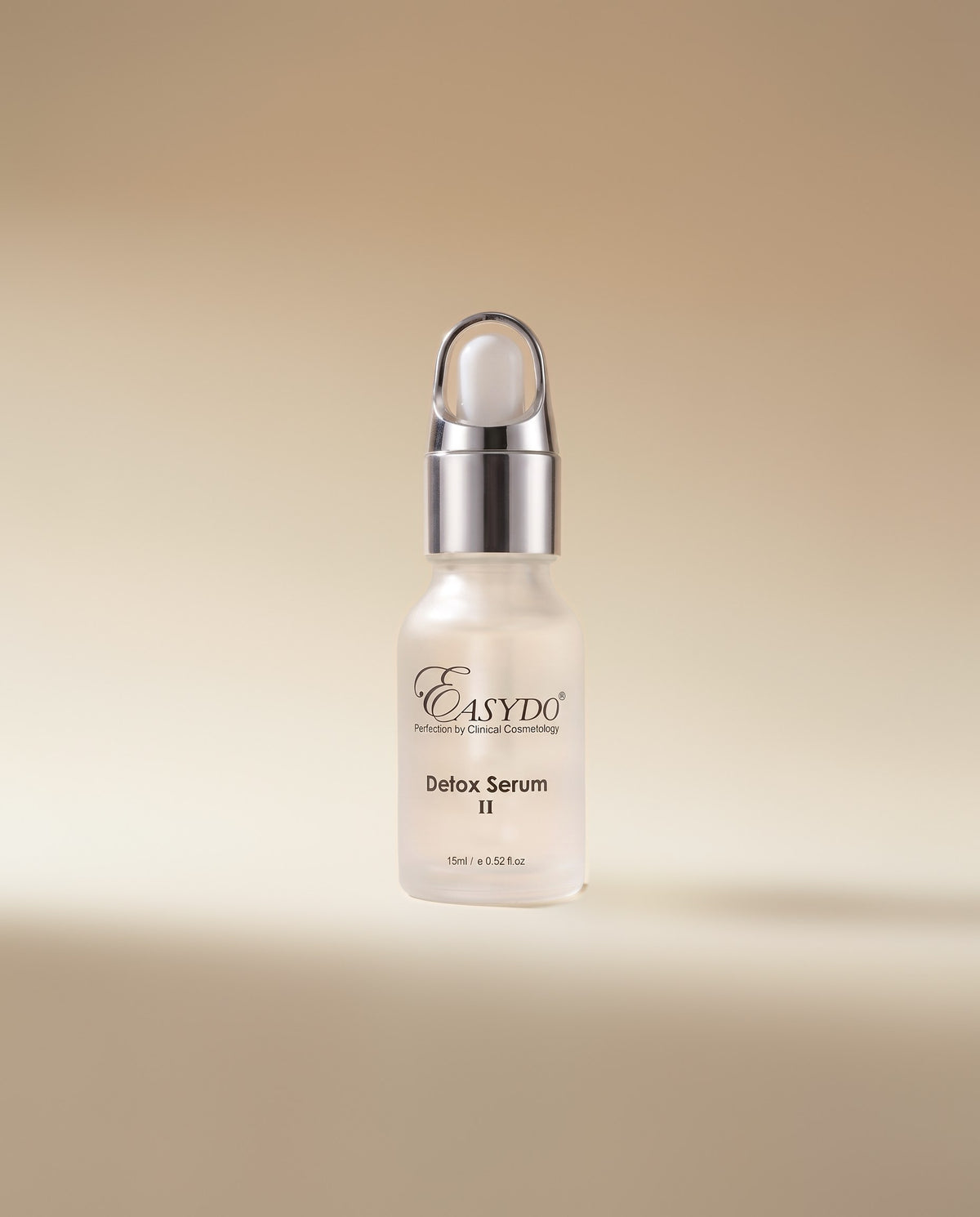 A frosted glass bottle of Easydo Detox Serum with a metallic silver dropper cap, centered against a warm beige gradient background.