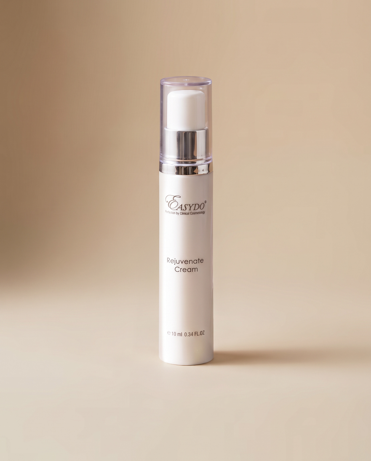 A white cylindrical skincare pump bottle labeled 'Easydo Polynucleate Cream' with a clear cap and silver collar, standing on a warm beige background.