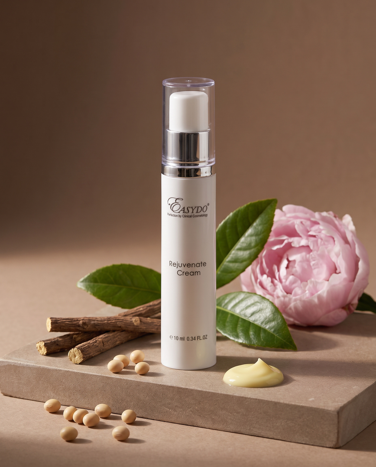 A white pump bottle of Easydo Peonyate Cream stands on a beige stone slab with scattered soybeans, a dollop of yellow cream, green leaves, and a pink peony flower against a warm brown background.